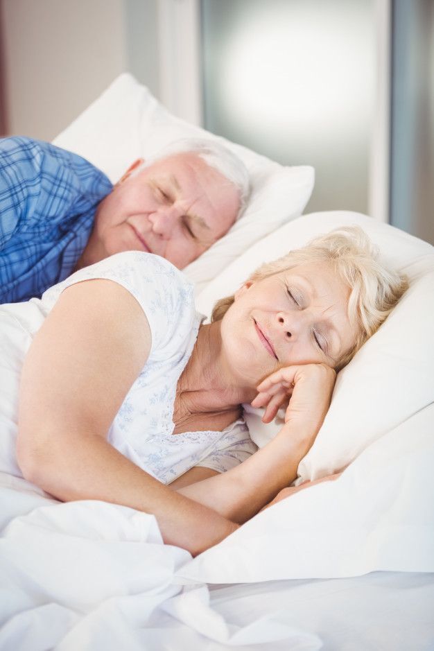 Premium Photo _ Smiling senior couple sleeping Say Goodbye to Sleepless Nights, The Ultimate Sleep Hacks for Deep Rest